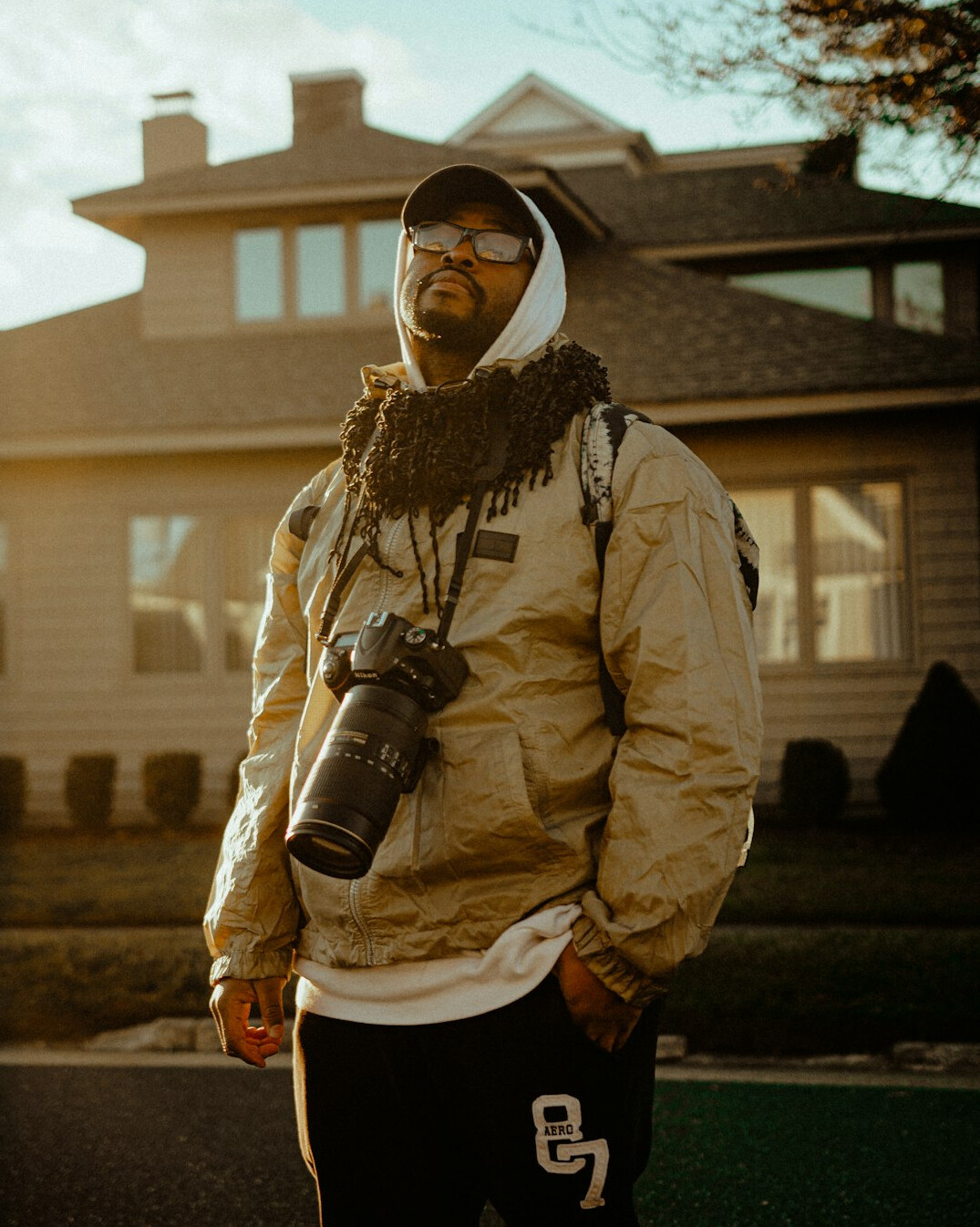 Portrait of a Black Canadian man photographer against a warm neutral background